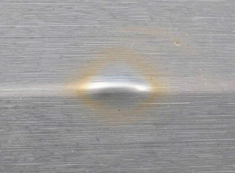 Stainless steel weld bead with clean silver and light straw color from good heat control