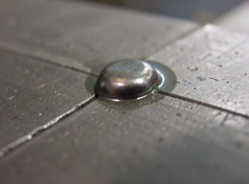 Weld bead sitting on top of the joint with poor fusion to the base metal, cold lap appearance