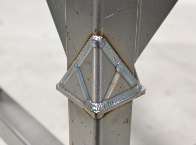 Gusset plate welded into the pivot joint of a motorcycle lift stand for added strength