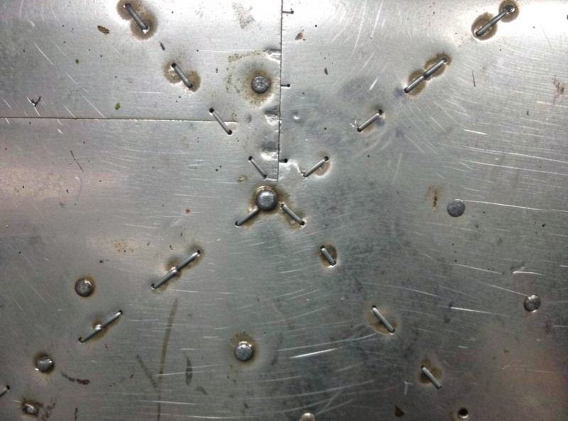 Stitch and skip welding pattern across a thin auto panel to prevent warping