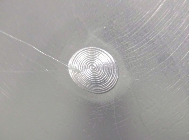 Bright spray-transfer aluminum weld bead with a fine even ripple on a clean plate